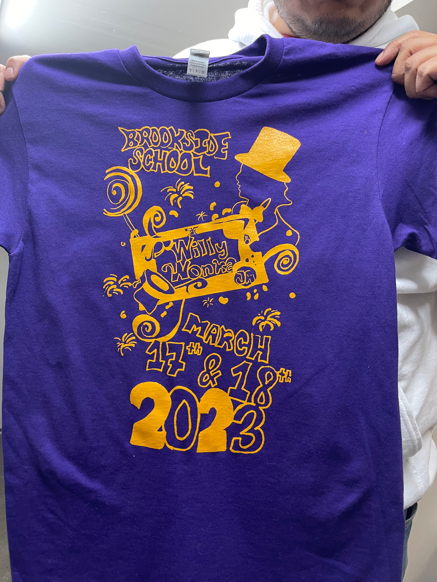 Purple Brookside School Willy Wonka event shirt with gold print.