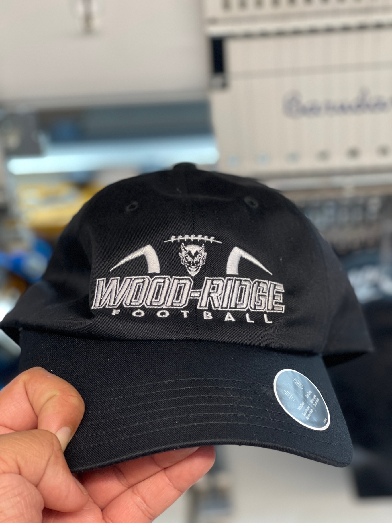 Black Wood-Ridge Football cap with white embroidery.